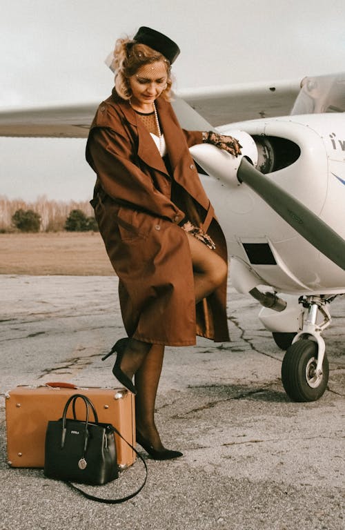 Woman Standing Near Airplane