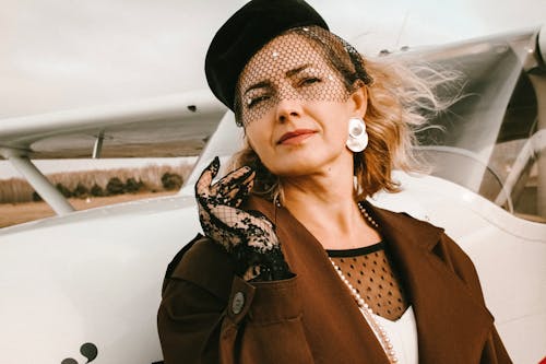 Woman Leaning on Aircraft