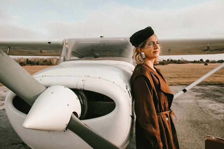 Woman Leaning On A Aircraft