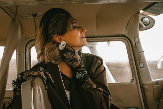 Charming vintage-inspired portrait of a woman in an airplane, embracing classic elegance.