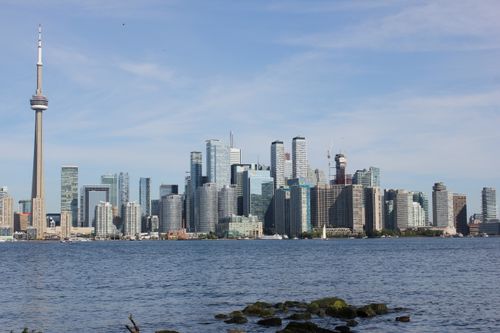 Free Stunning view of Toronto skyline with iconic CN Tower and waterfront in daylight. Stock Photo