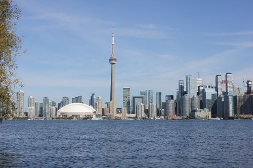 Free A stunning view of Toronto's skyline with the CN Tower on a sunny day. Stock Photo