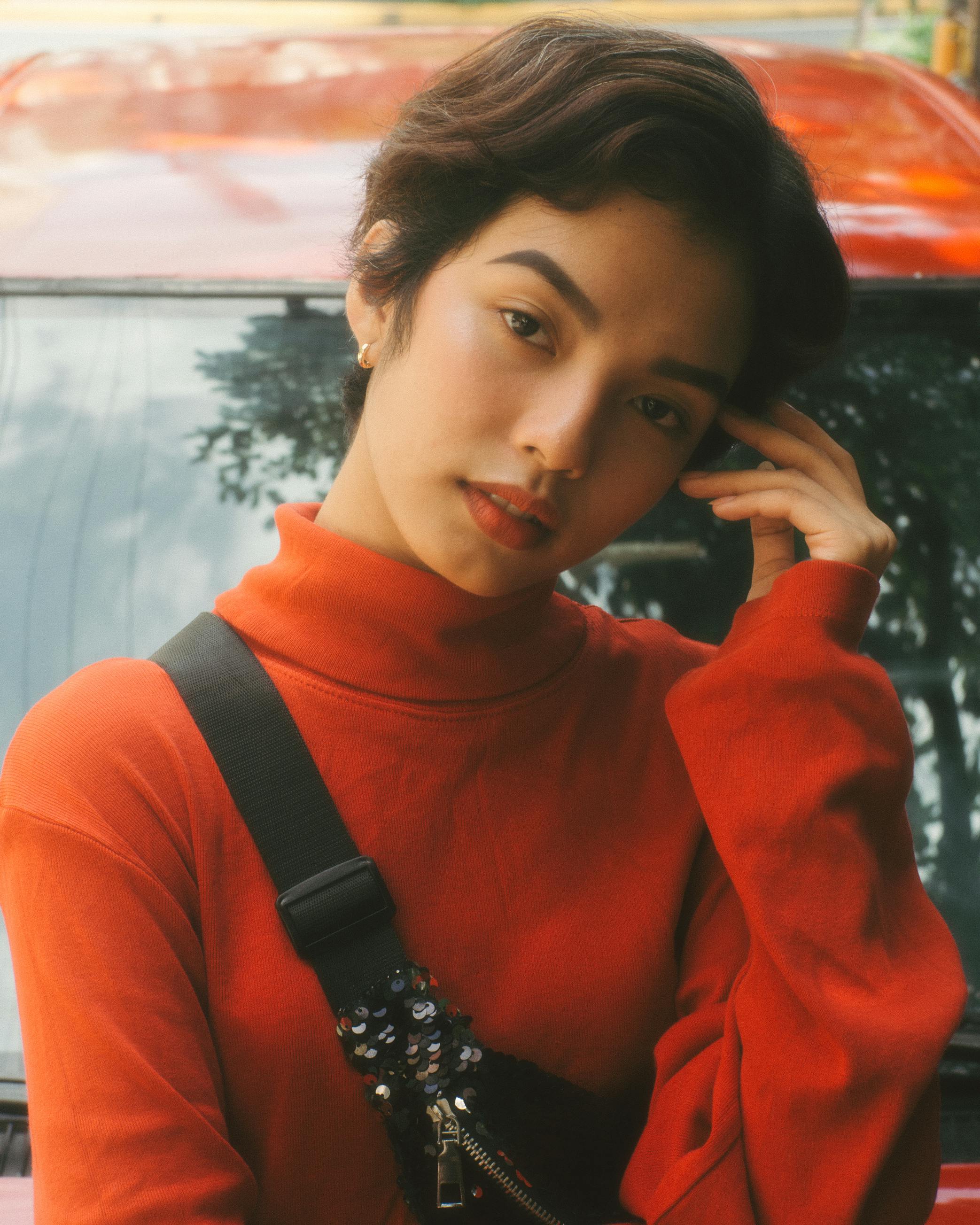 woman wearing red turtleneck top