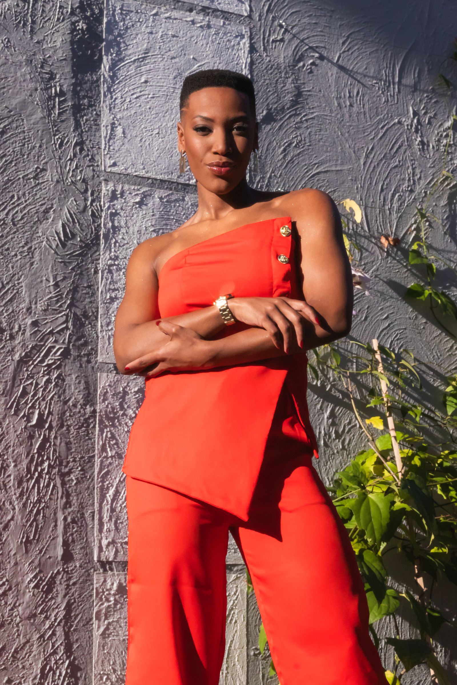 Woman wearing peplum top with tailored trousers