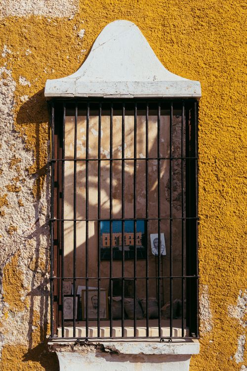 Free Historic colonial window with wrought iron bars in San Francisco de Campeche, Mexico. Stock Photo