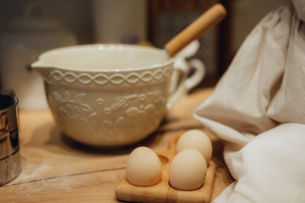Ceramic mixing bowl and eggs on a wooden countertop — Seljan Salimova on Pexels