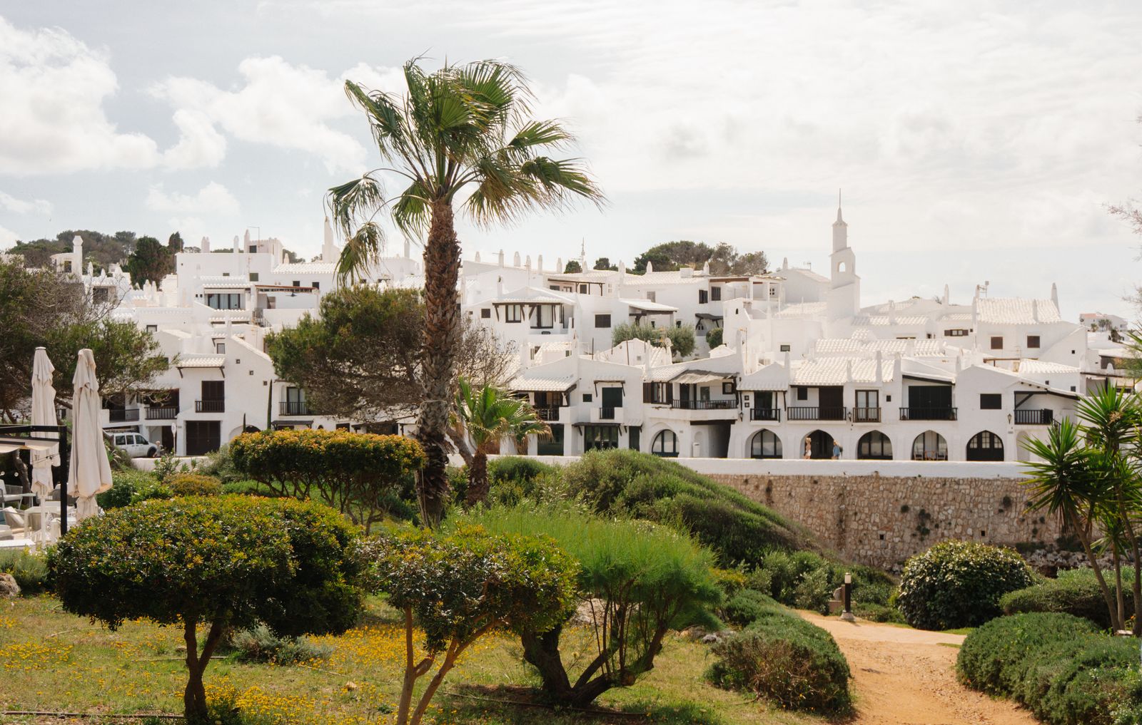 Whitewashed buildings and greenery in Ciutadella de Menorca