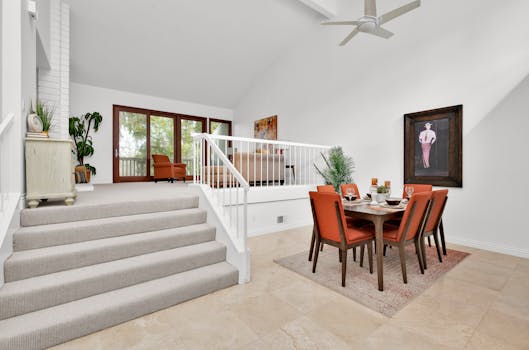 Bright and modern dining area with orange accents in an Irvine, CA home interior.