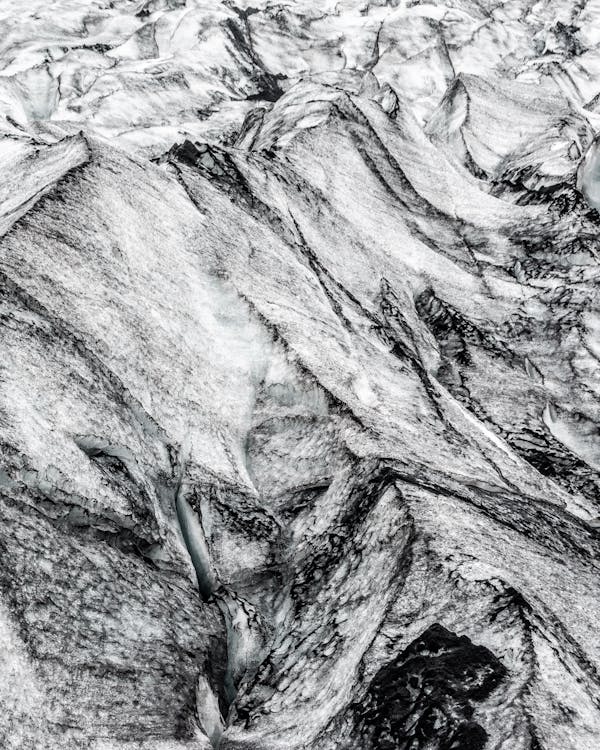 Close Up Photo of Black and White Rock Formation