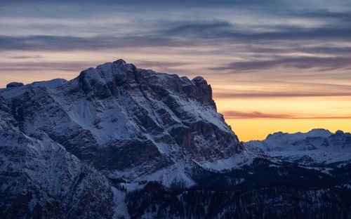 Free Stunning winter sunset view of snow-covered Dolomite mountains in Trentino-South Tyrol, Italy. Stock Photo