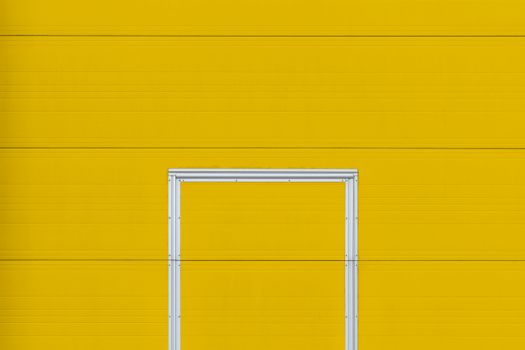Minimalistic design featuring a bright yellow wall and a metal frame, perfect for creative projects.