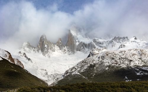 Free Breathtaking view of the snowy peaks of Mount Fitz Roy with clouds in Argentina's Patagonia. Stock Photo