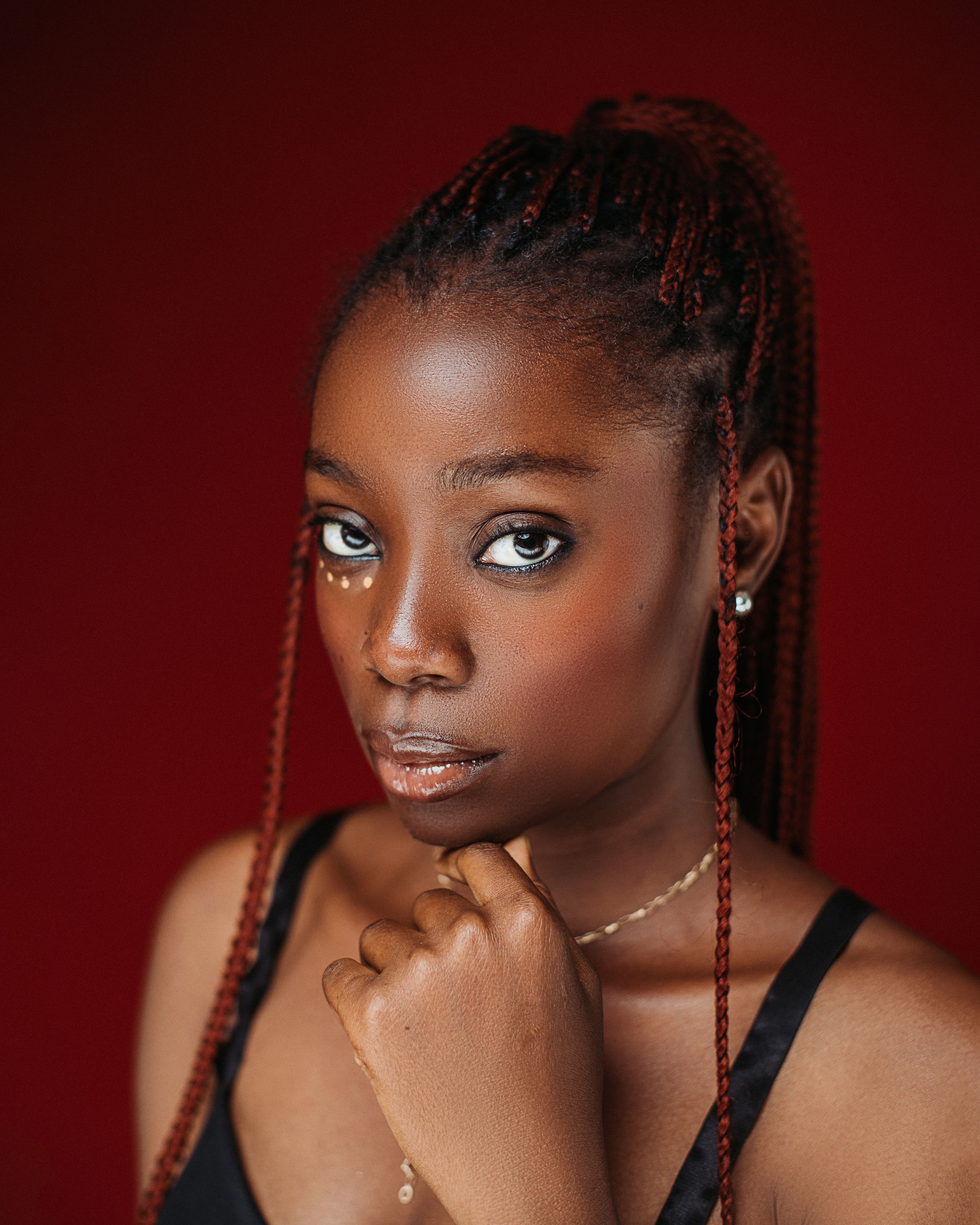 Elegant Portrait of Woman with Red Background · Free Stock Photo