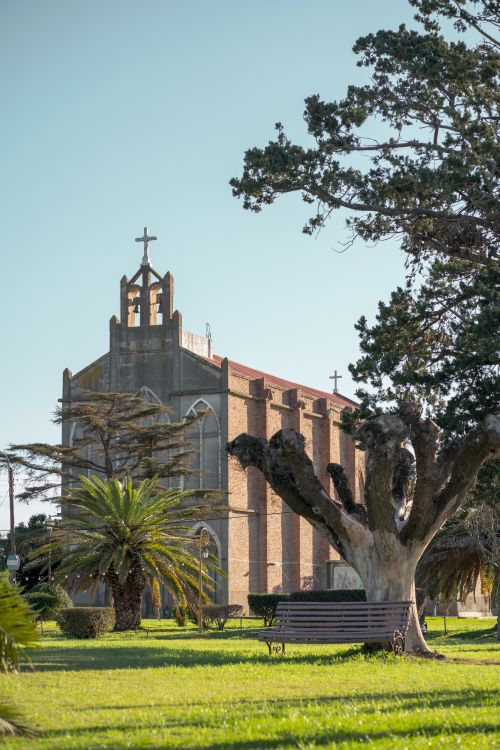 Free View of a traditional church facade in sunny Punta del Agua, Córdoba, Argentina. Stock Photo