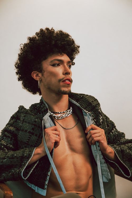 Free Stylish portrait of a young adult showcasing modern fashion with confidence and flair. Stock Photo