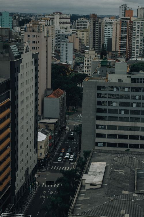 Free Aerial view of a dense cityscape with high-rise buildings and busy streets. Stock Photo