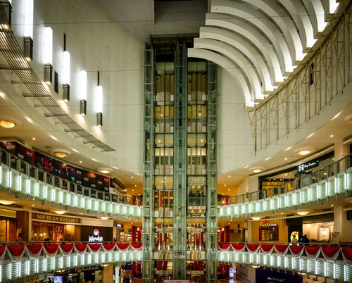 Free Modern architectural design of a mall interior in Jakarta, showcasing bright lighting and multiple floors. Stock Photo