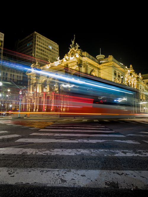 Free Stunning night shot of Theatro Municipal in São Paulo with light trails from passing vehicles. Stock Photo