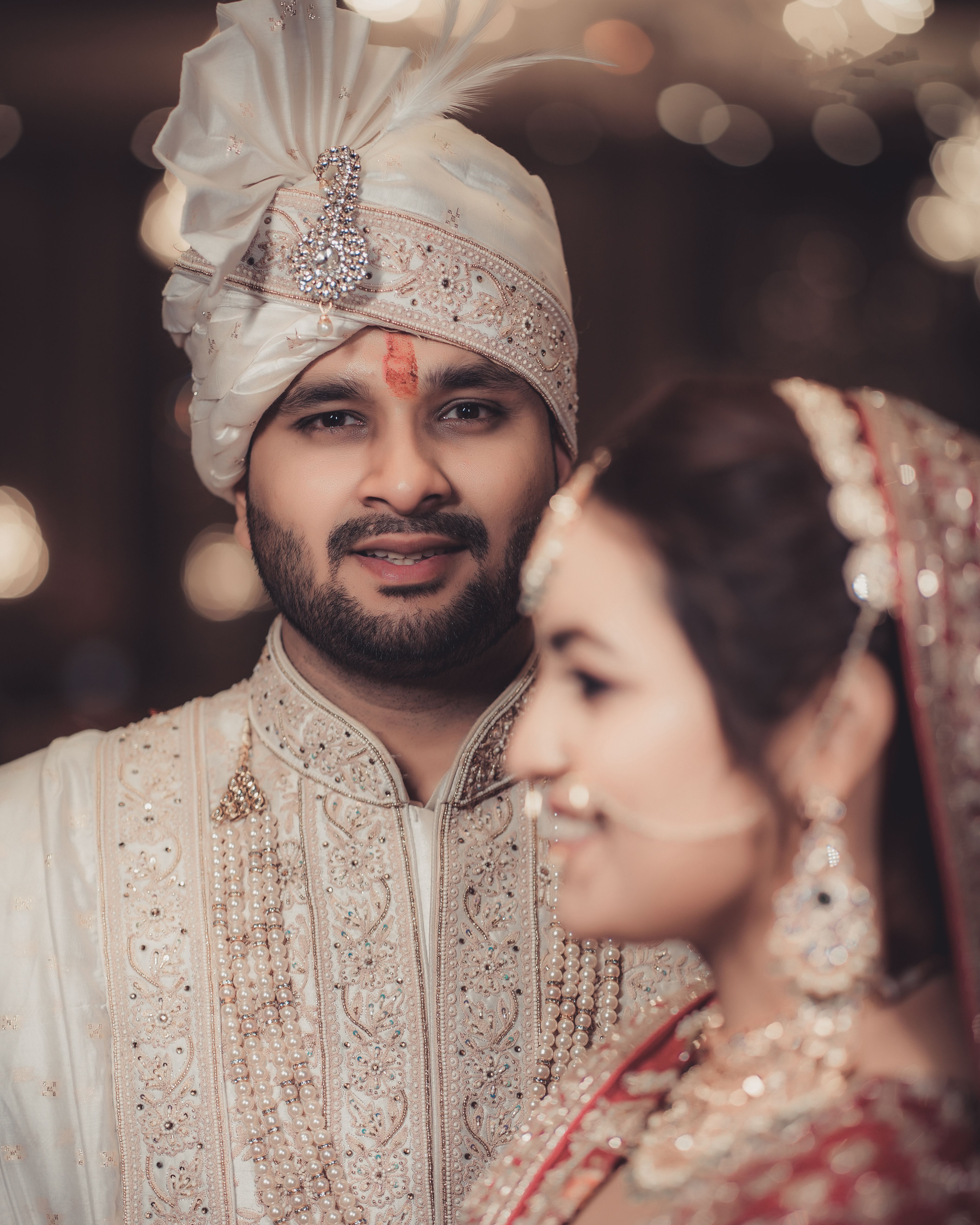 Beautiful portrait of an Indian couple on their wedding day in traditional attire