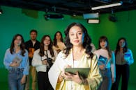 Diverse Media Team in Green Screen Studio