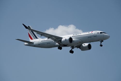 Free Air France airplane captured mid-flight against a clear sky in Hamburg, Germany. Stock Photo