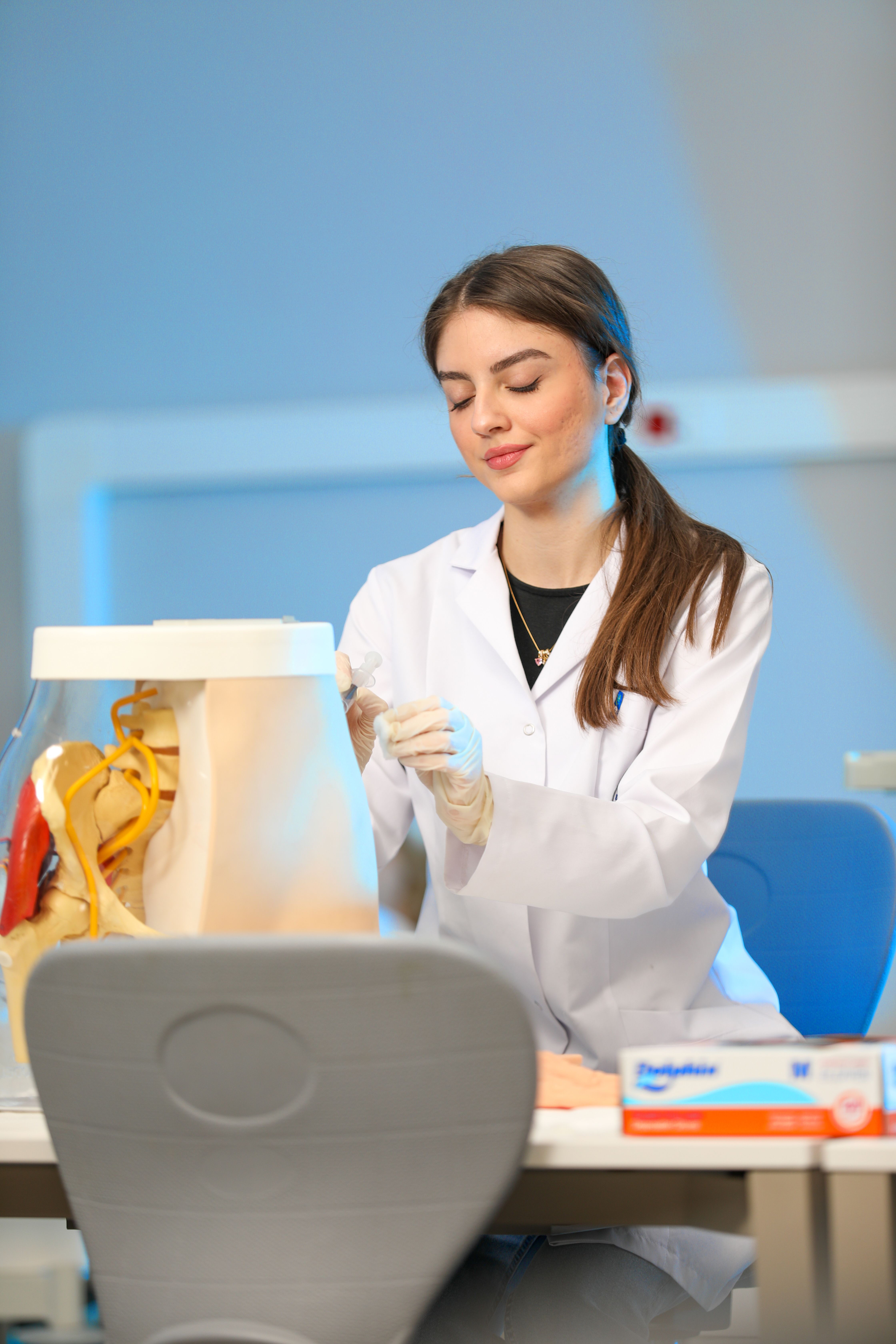 Young Scientist Studying Anatomical Model in Lab · Free Stock Photo