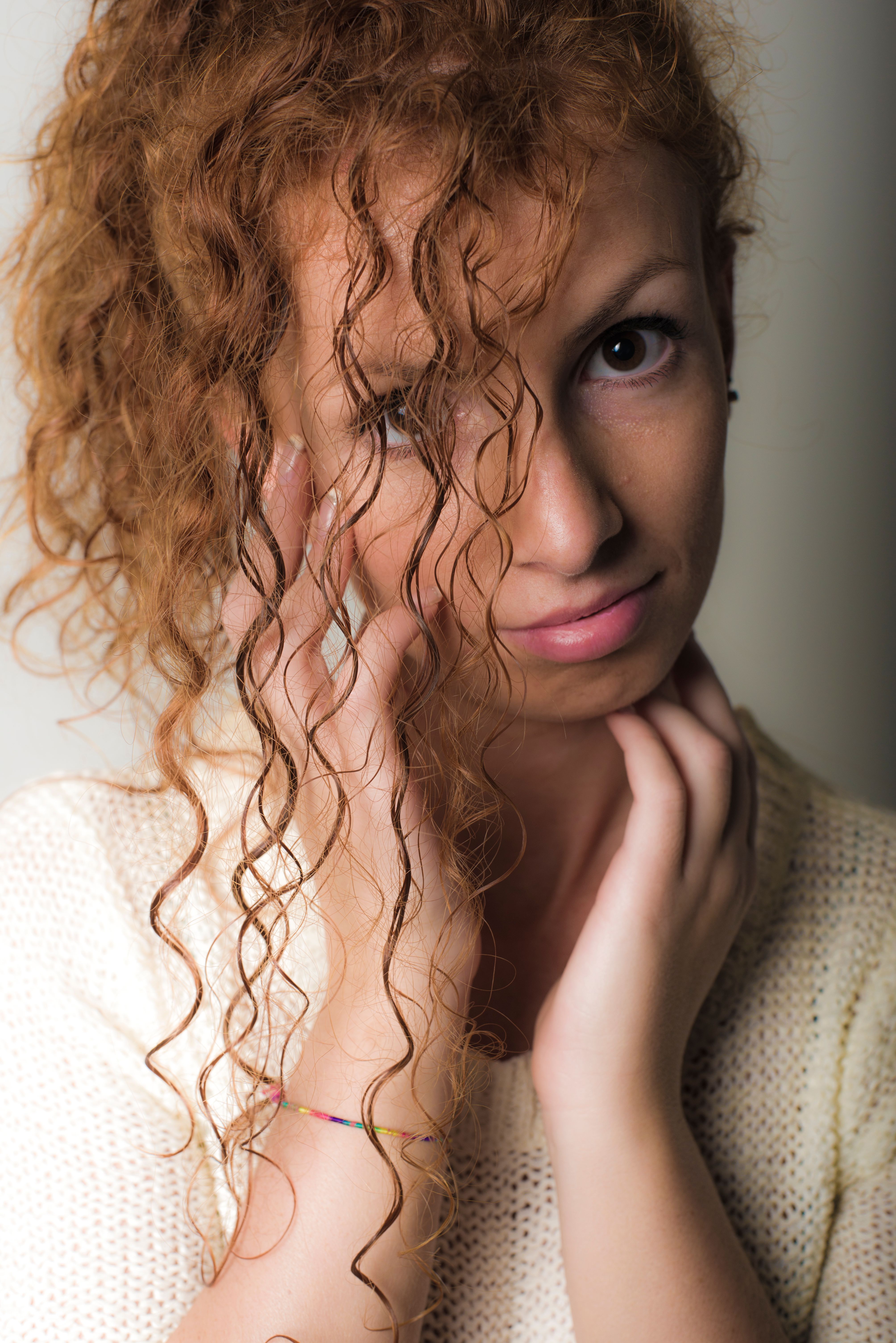 Portrait of a Woman with Curly Red Hair · Free Stock Photo