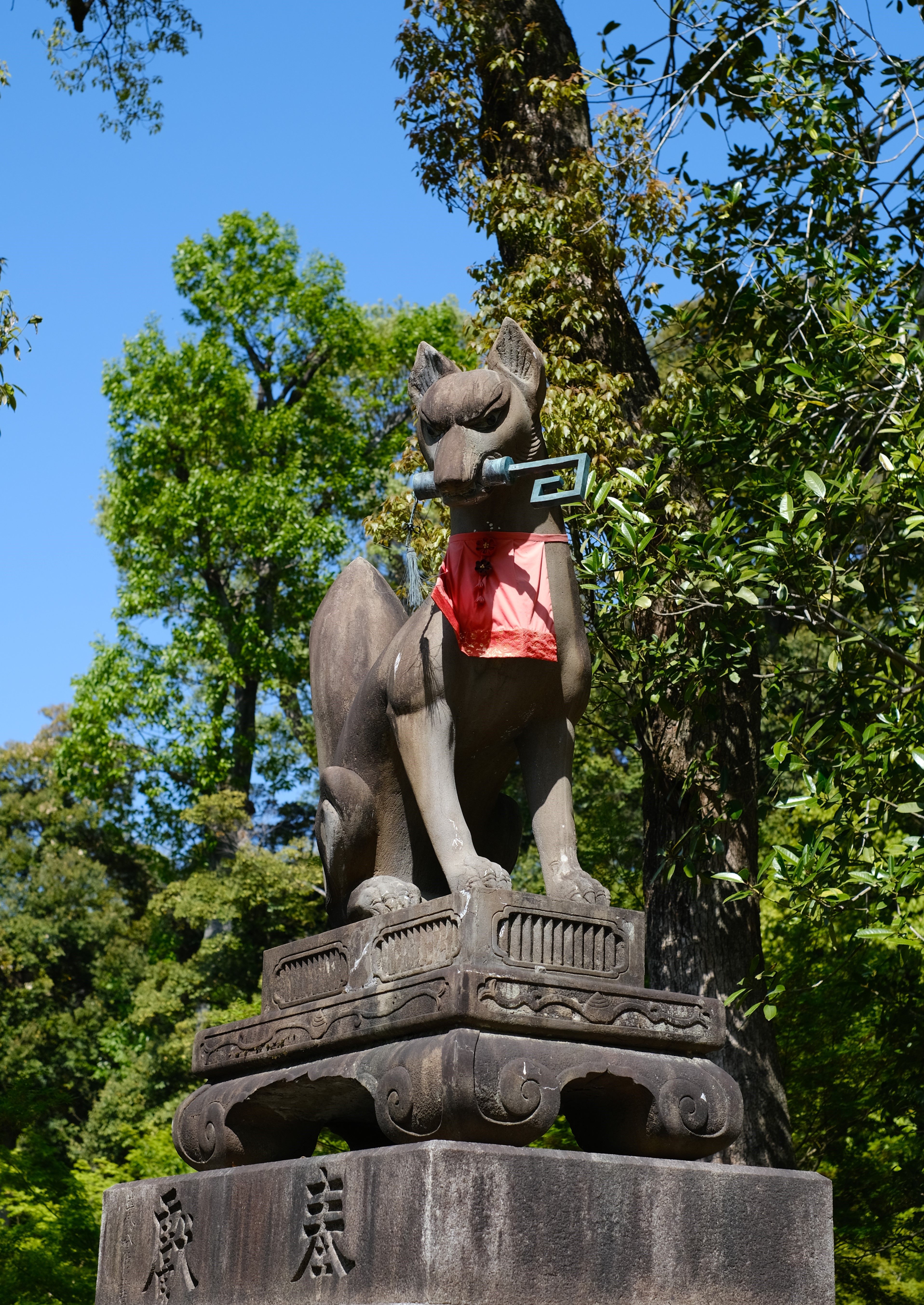 Inari Fox Statue in Lush Green Park · Free Stock Photo