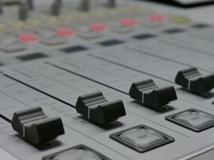 Close view of mixing-desk faders — photo by Matthias Wunderlich on Pexels