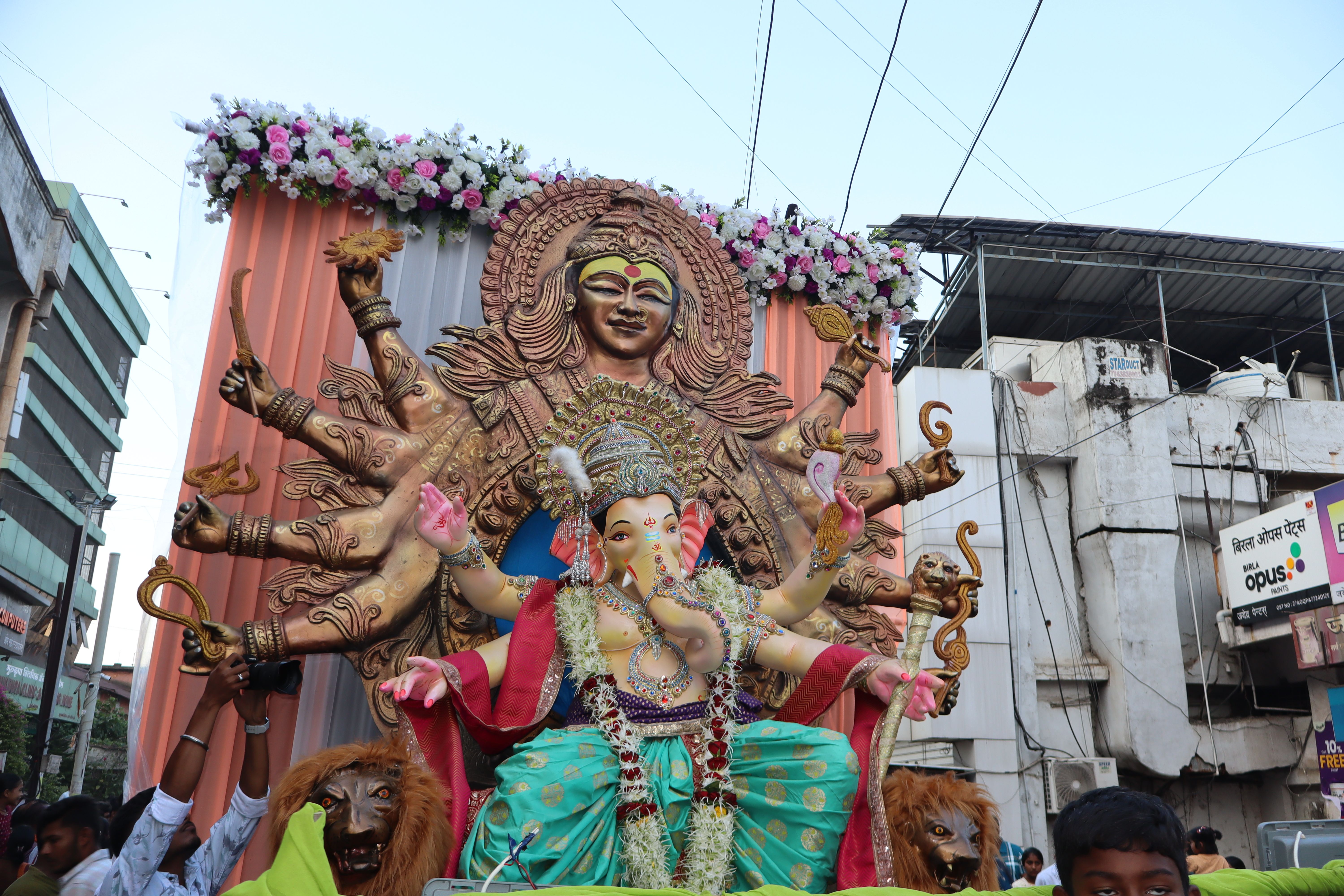Colorful procession of Ganesh Visarjan in Chandrapur, Maharashtra, India during the vibrant festival.