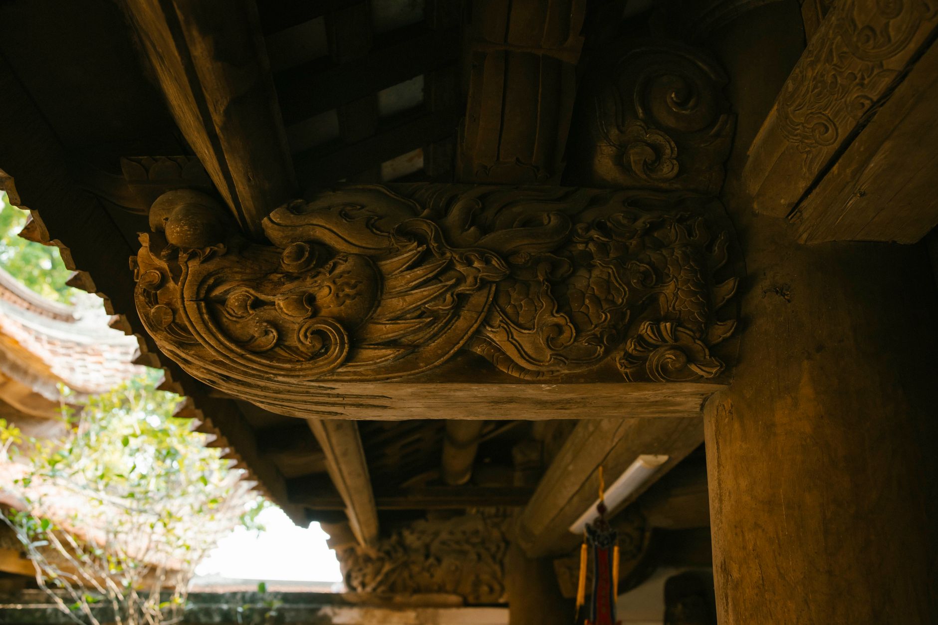 Close-up of ornate wooden carvings showcasing traditional craftsmanship in architecture.