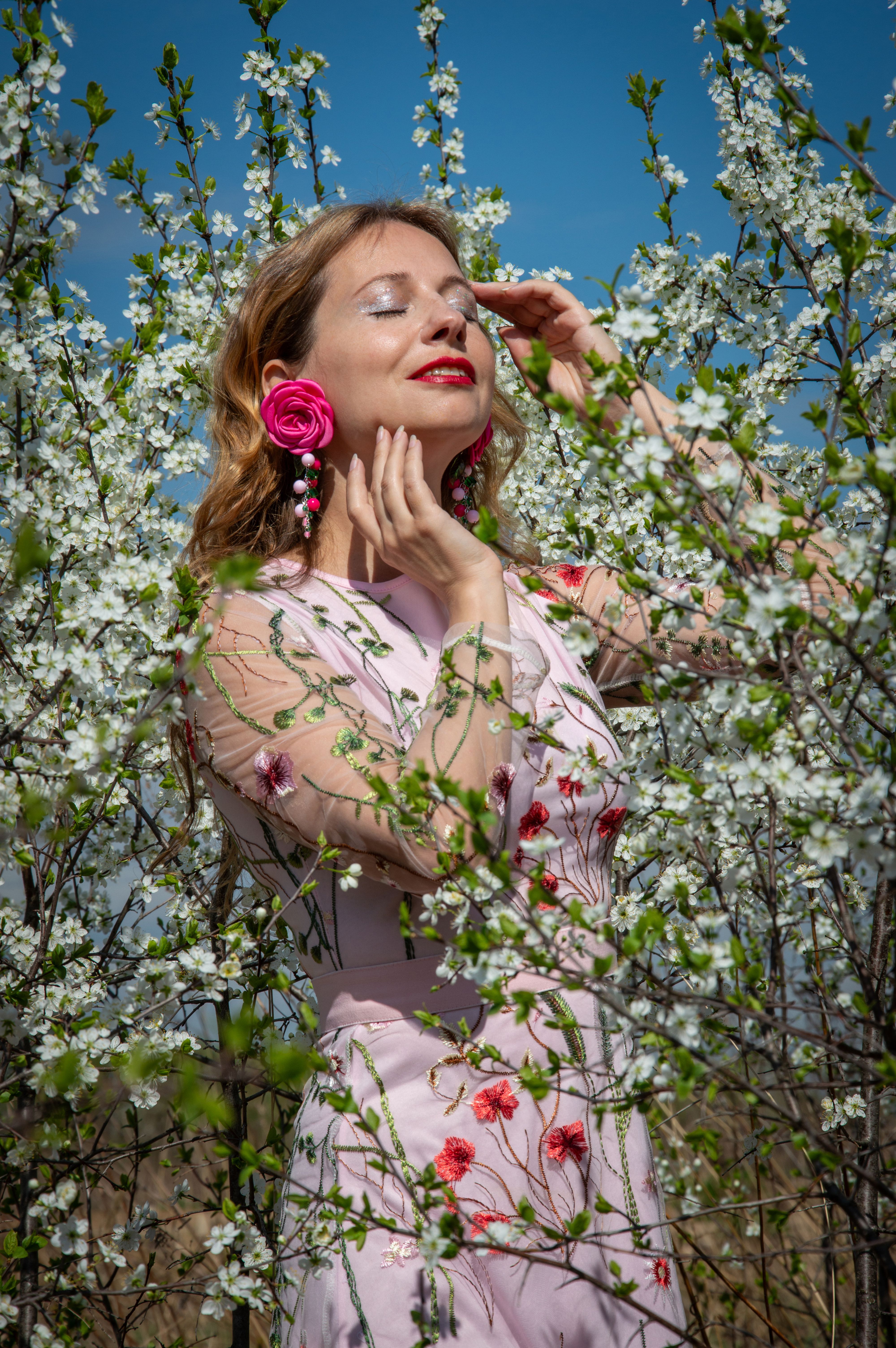 Woman Enjoying Spring Blossoms Outdoors · Free Stock Photo