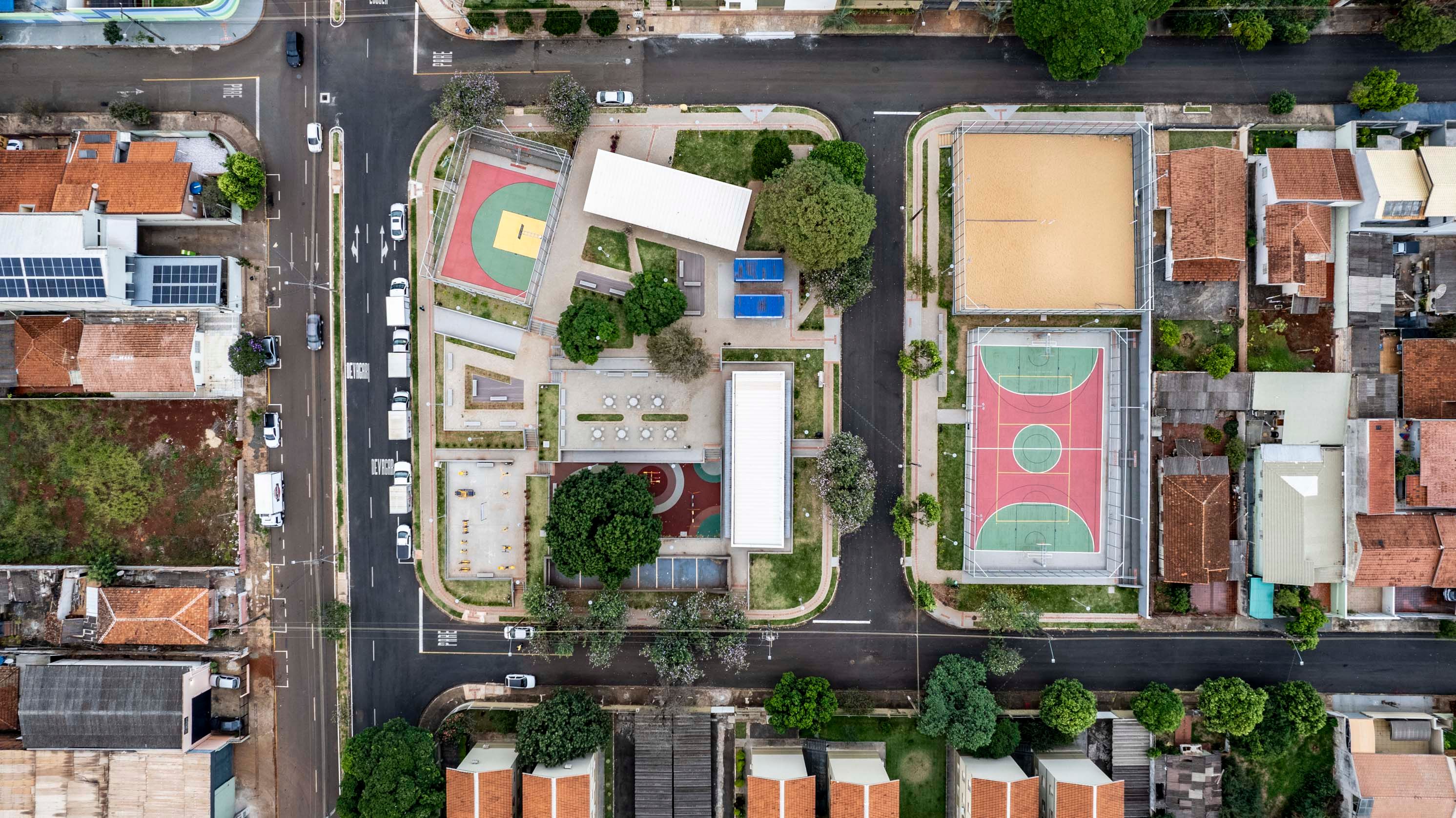 Aerial shot of a vibrant plaza with sports courts in Londrina, Brazil.