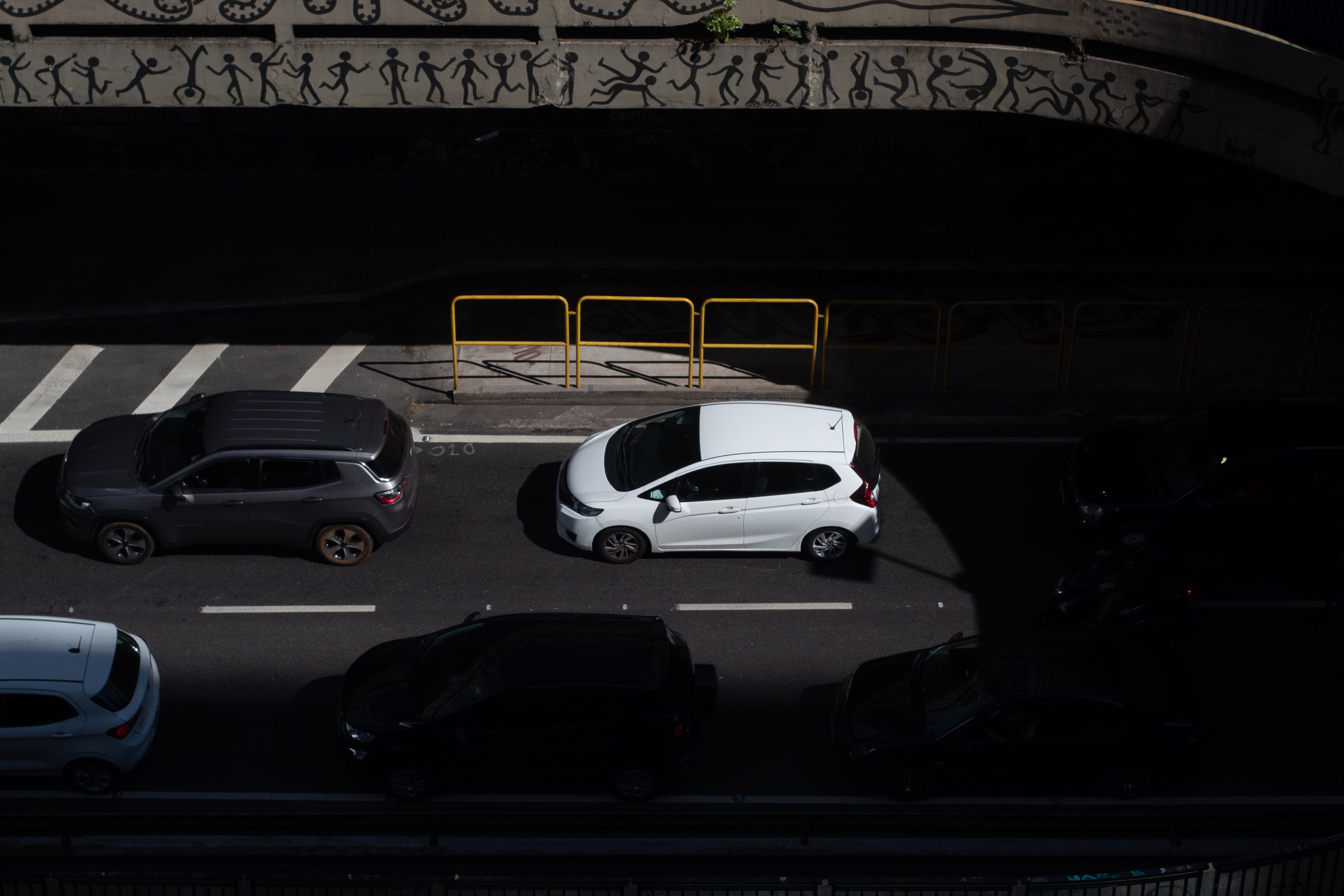 Fiat Mobi or Renault Kwid economy car parked on a street in Brazil