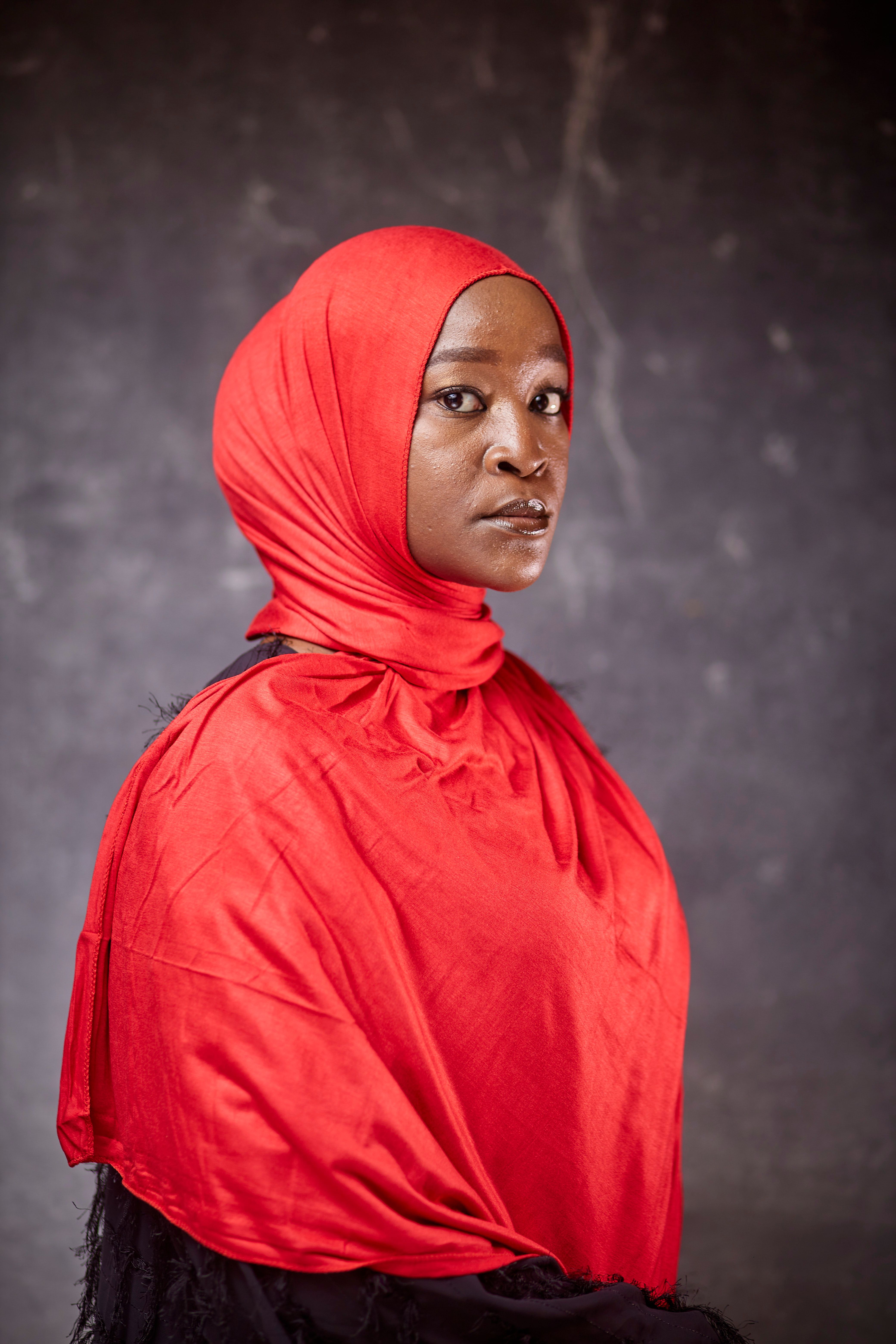 Portrait of Woman in Vibrant Red Hijab · Free Stock Photo