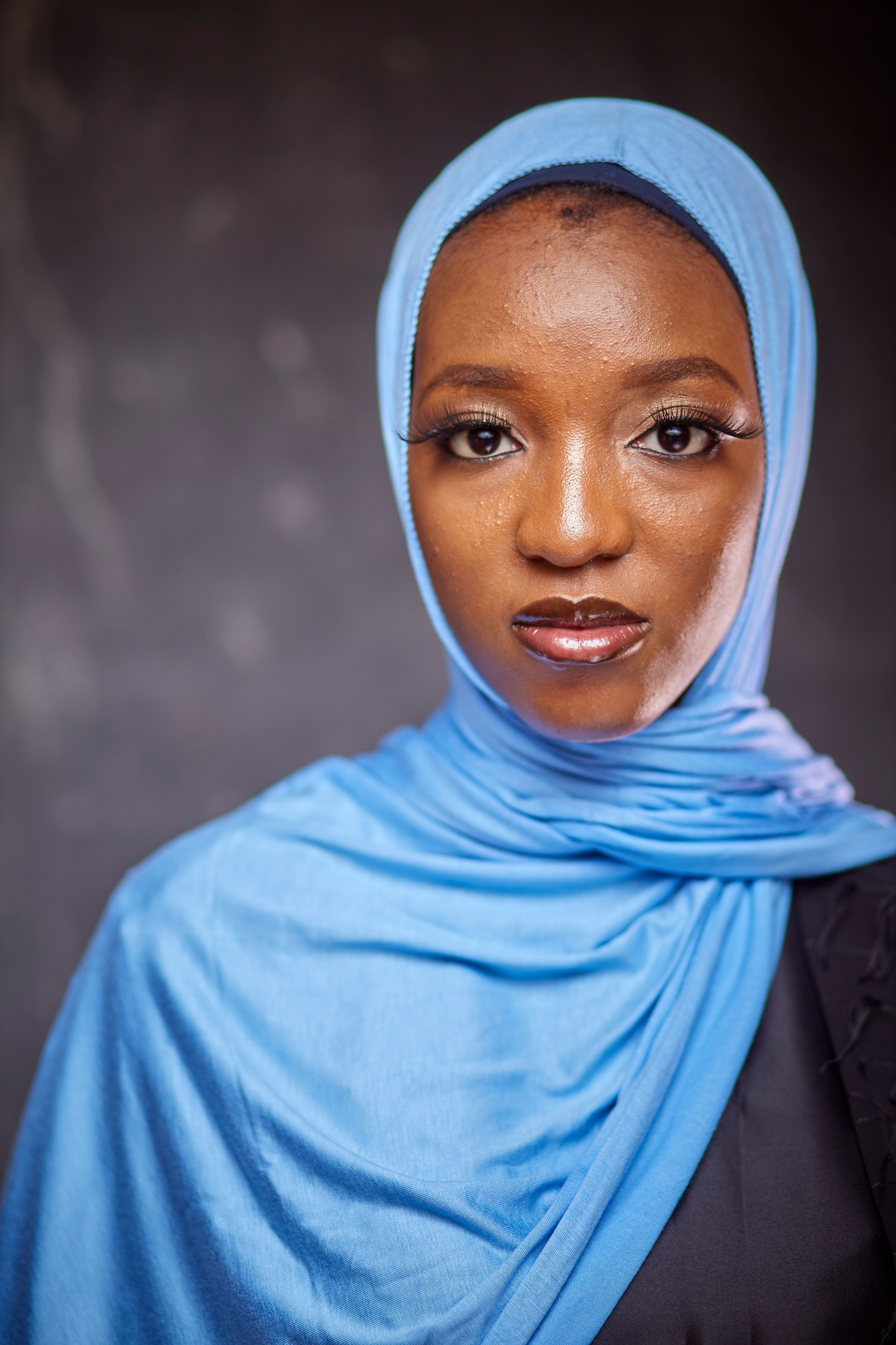 Portrait of a Woman in Blue Hijab with Neutral Background · Free Stock ...
