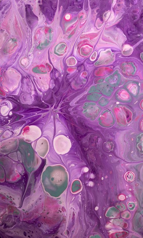 Free Colorful abstract artwork featuring vivid purple paint swirls and bubbles. Stock Photo
