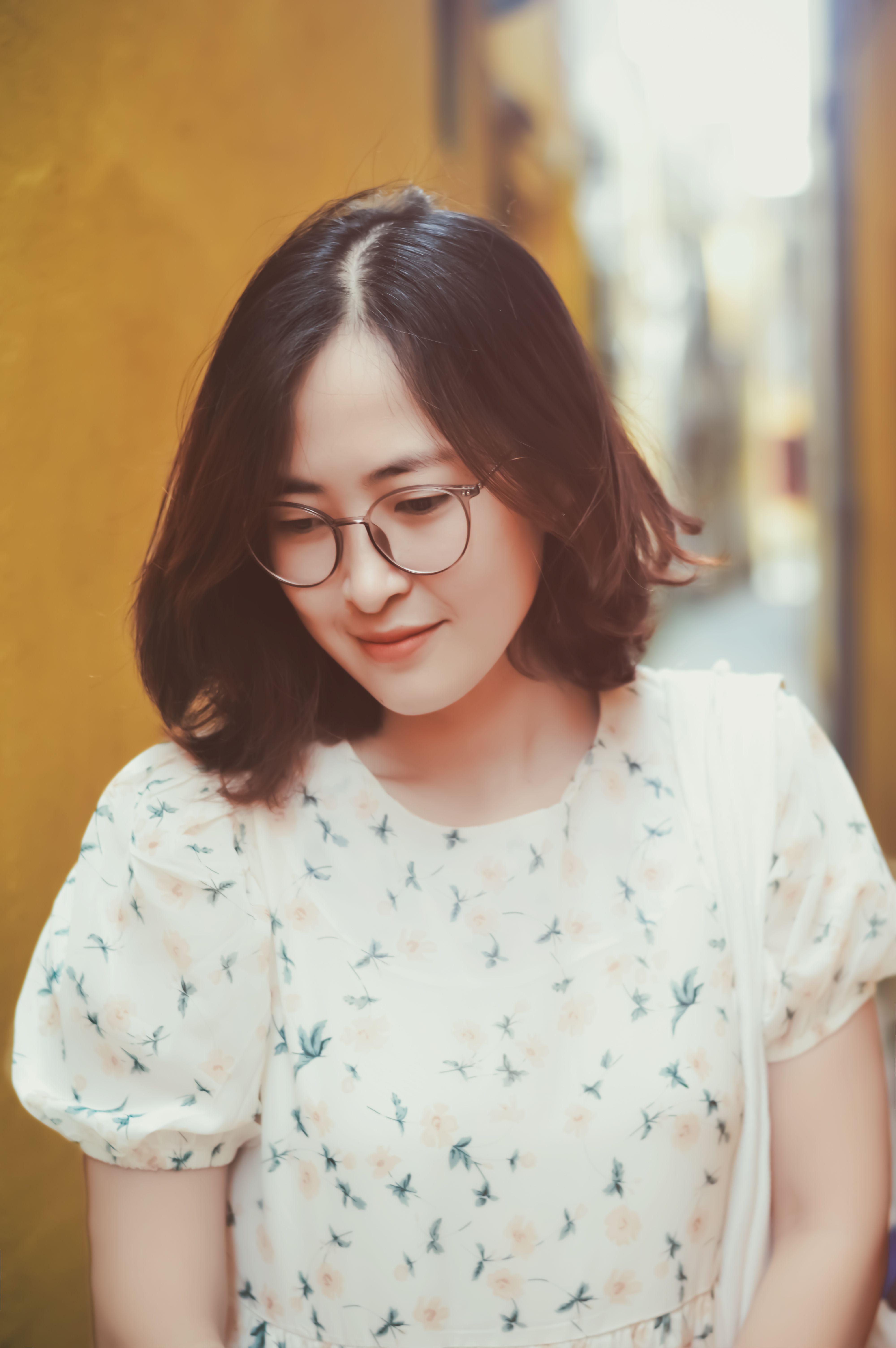 Young Woman with Glasses in Stylish Dress Outdoor Portrait