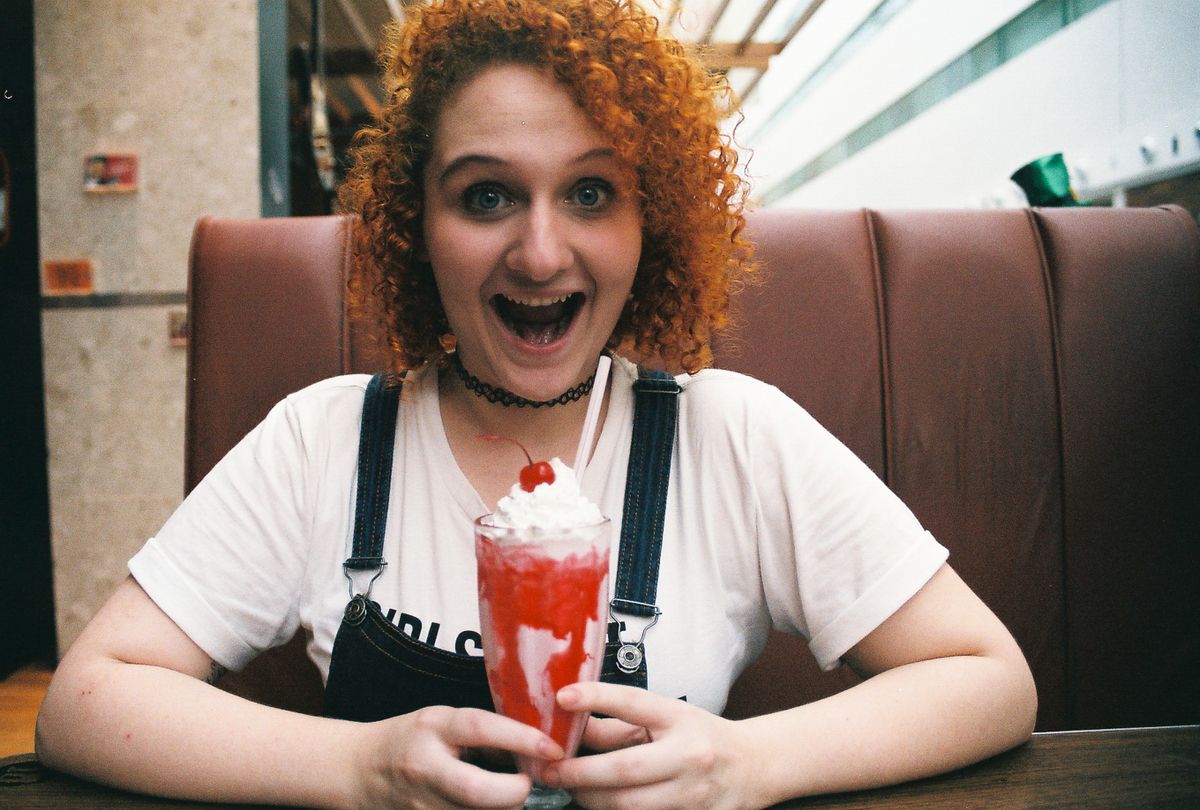Joyful moment enjoying a handmade soda fountain milkshake