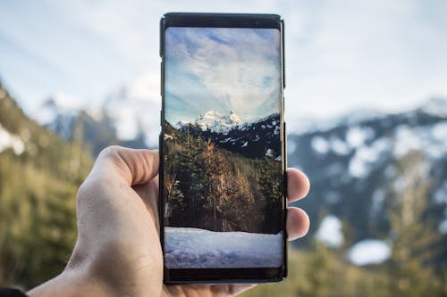 Person Holding Black Android Smartphone