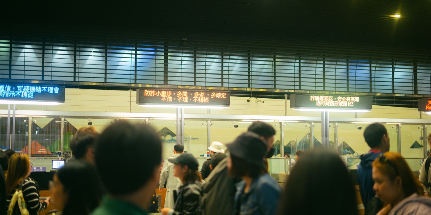 A busy European airport check-in and border area where the new EES system now operates in 2026