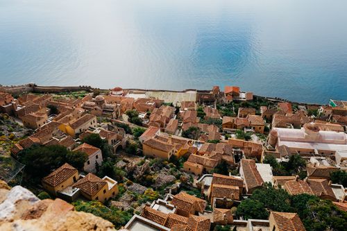 Free Discover the stunning aerial view of Monemvasia's historic architecture framed by the serene Mediterranean Sea. Stock Photo