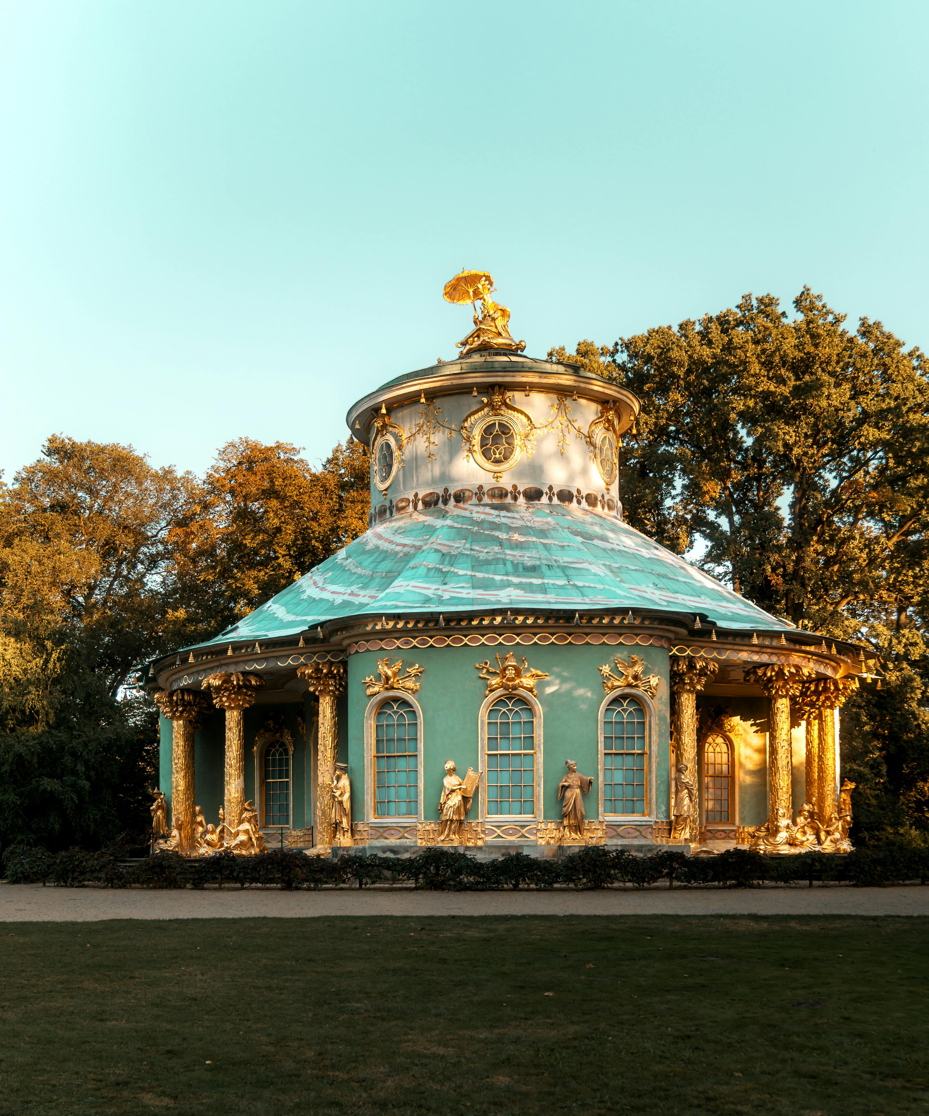 Beautiful view of the ornate Chinese House in Potsdam's Sanssouci Park during daylight.