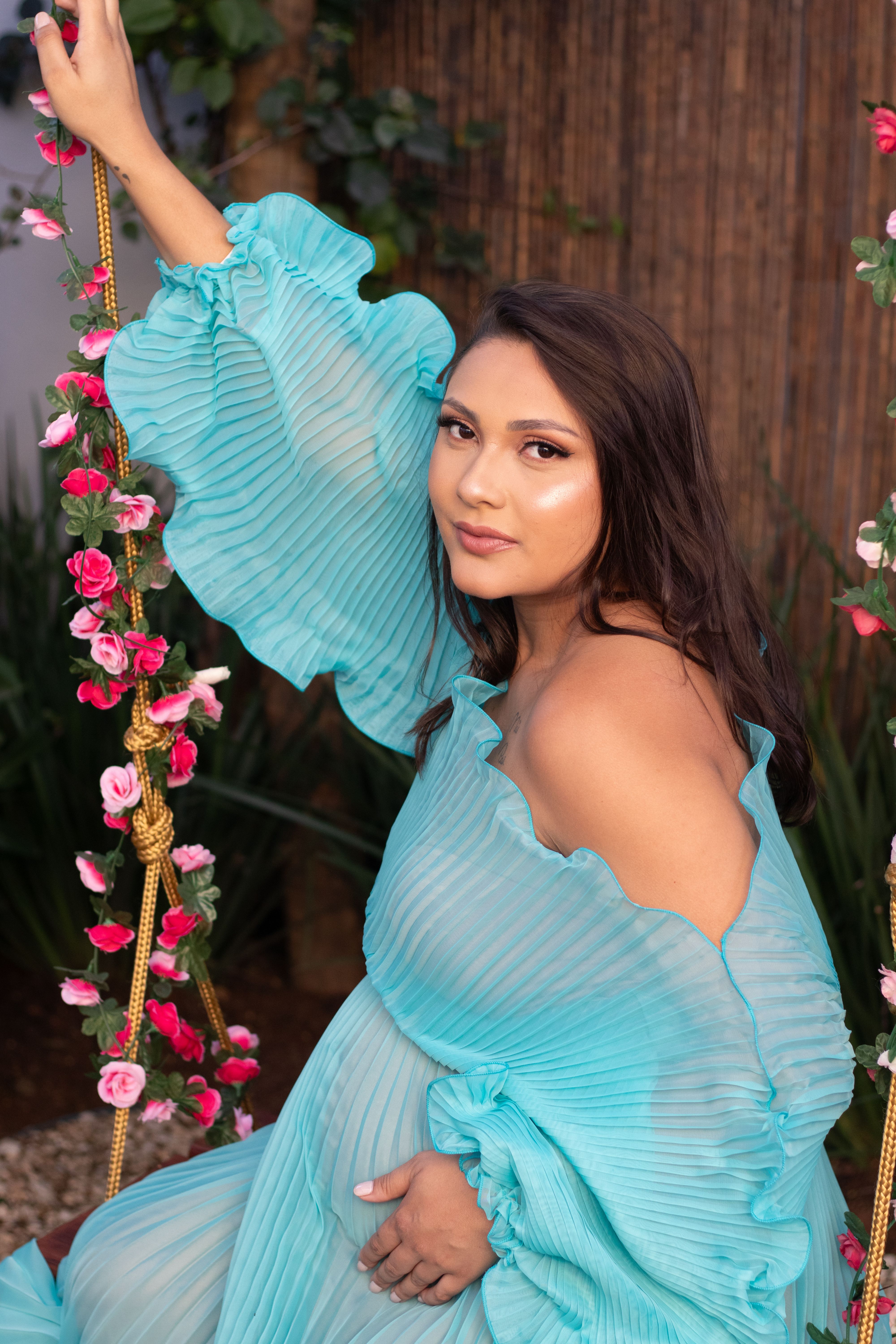 Portrait of Woman in Blue Dress on Floral Swing · Free Stock Photo
