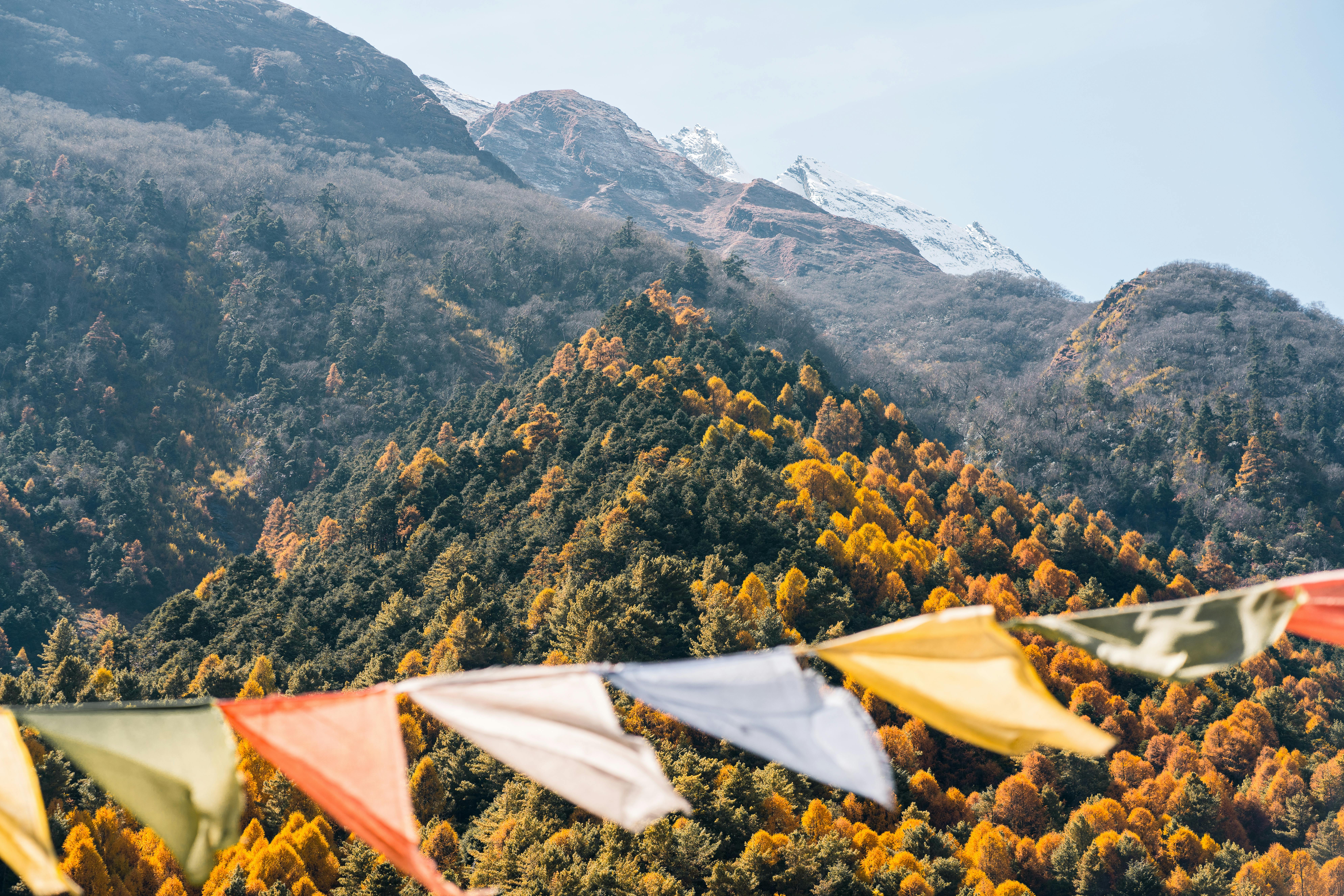 Breathtaking view of Himalayan mountains with colorful prayer flags in Nepal.