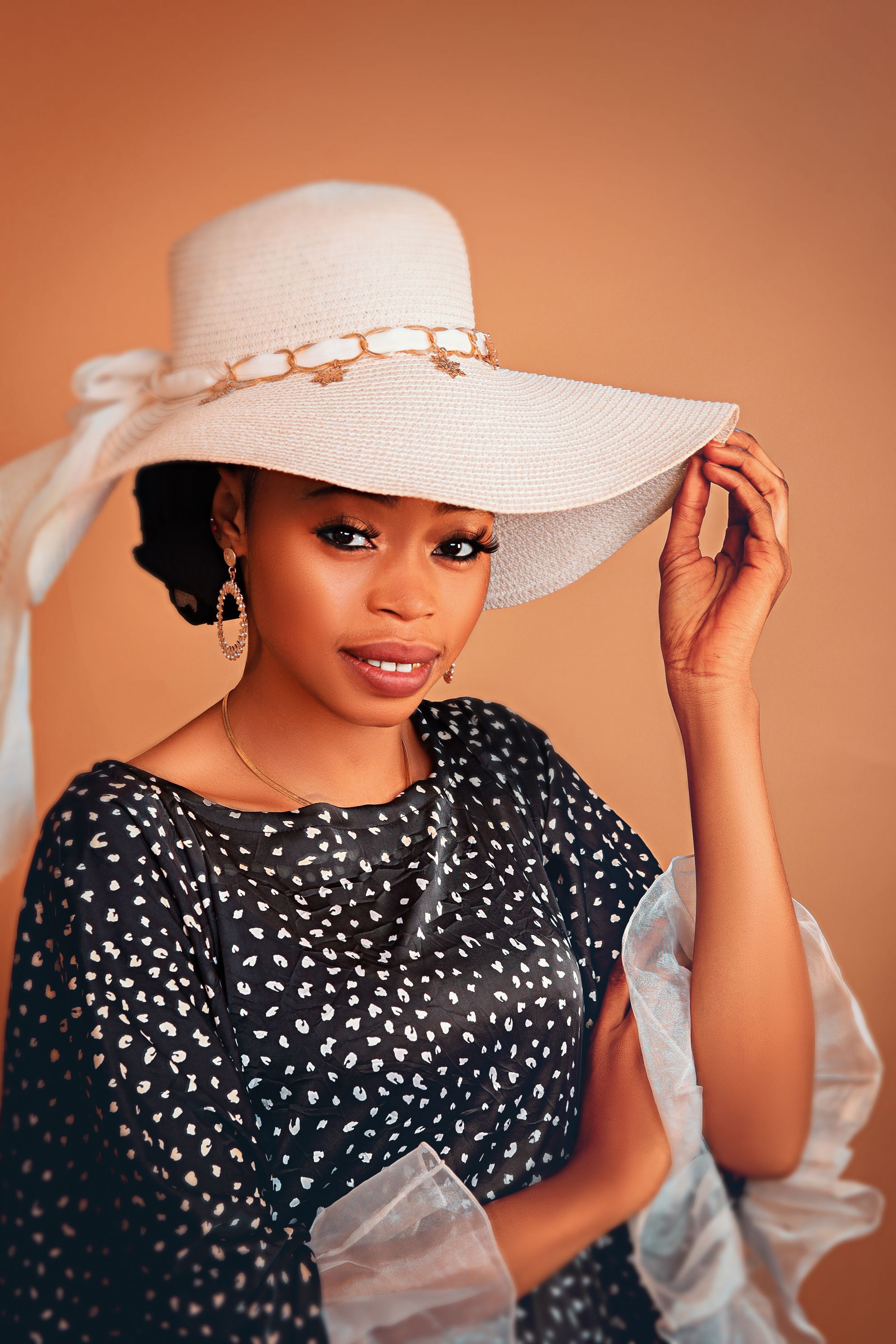 Elegant Woman in a Stylish Hat Portrait · Free Stock Photo