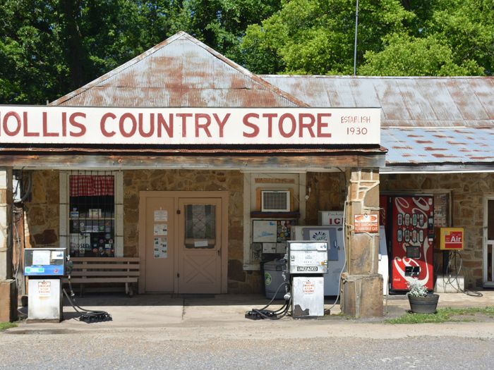 Rustic country store near Hot Springs Village, Arkansas with vintage gas pumps and signage.