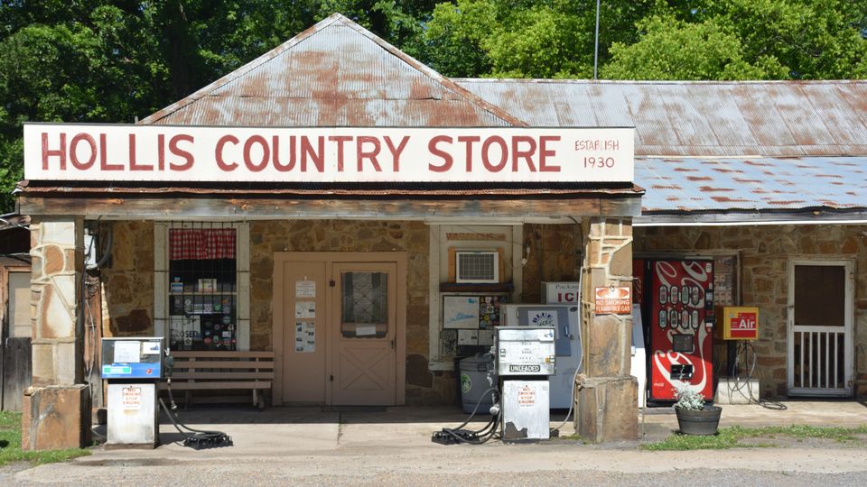 Rustic country store near Hot Springs Village, Arkansas with vintage gas pumps and signage.