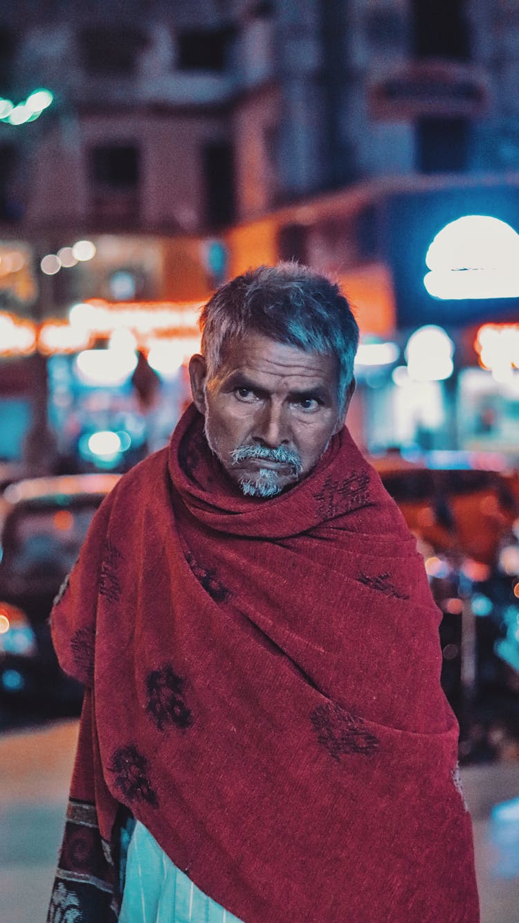 Old Ethnic Man Standing On City Street