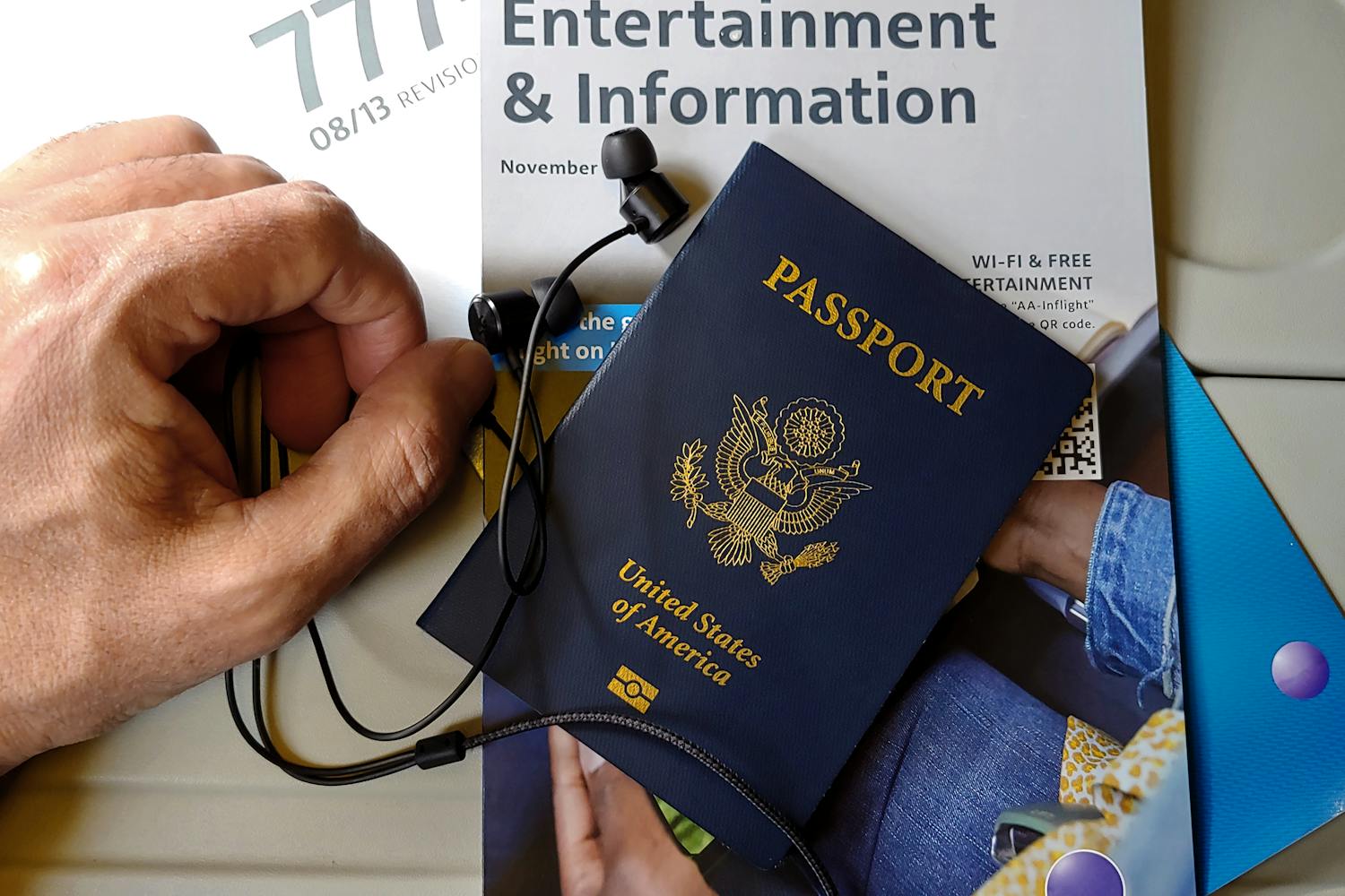 Travel documents and passport on airplane